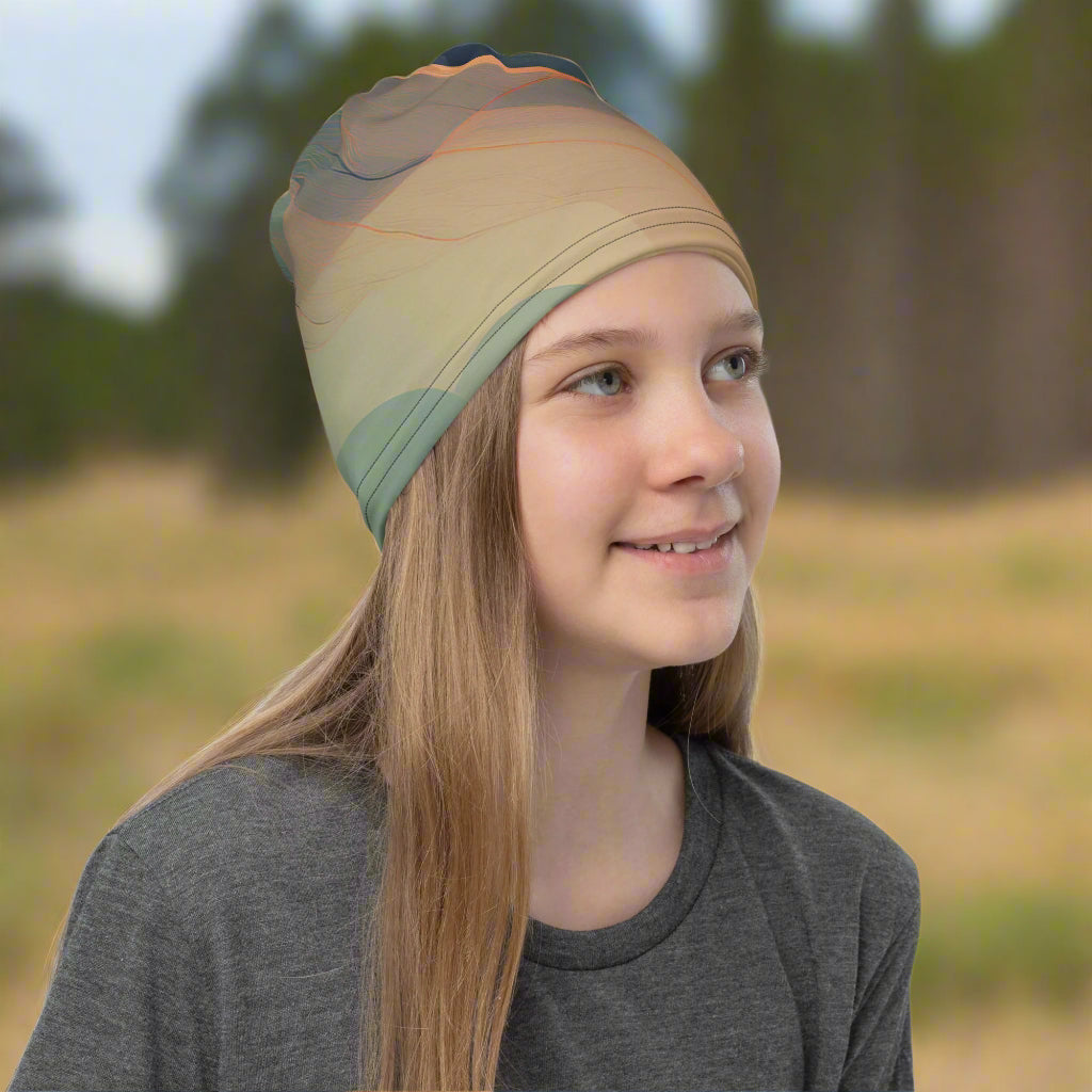 girl wearing a necjk gaiter from Rosenmay Studio with at rooted pattern and sand colors