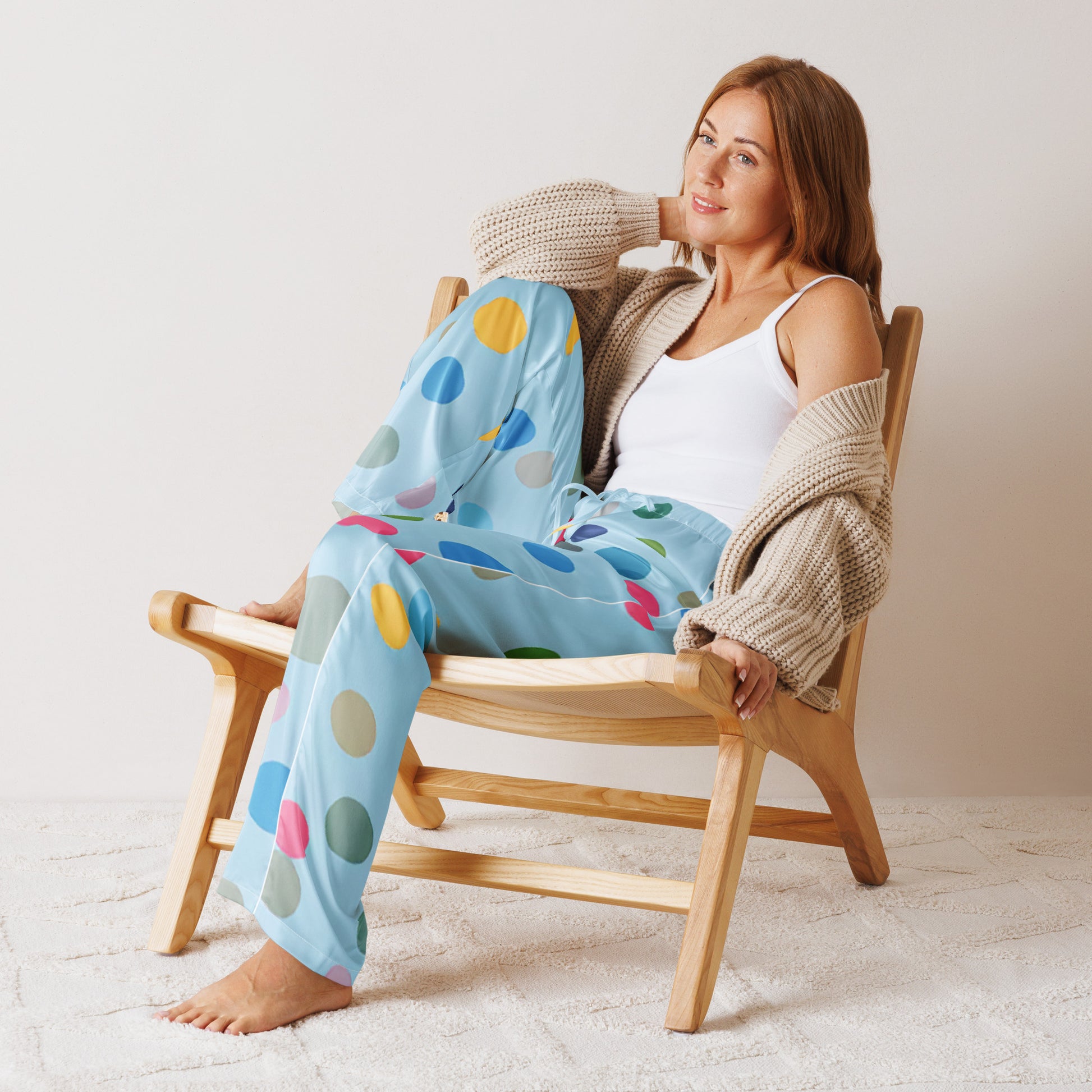 Woman wearing soft, long pajama pants with a happy dotted  print from Rosenmay Studio