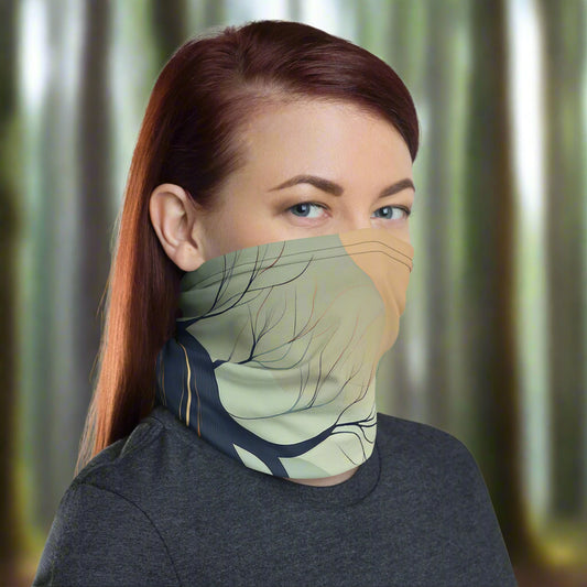 Woman wearing a neck gaiter from Rosenmay Studio, with earthy colors and a root print