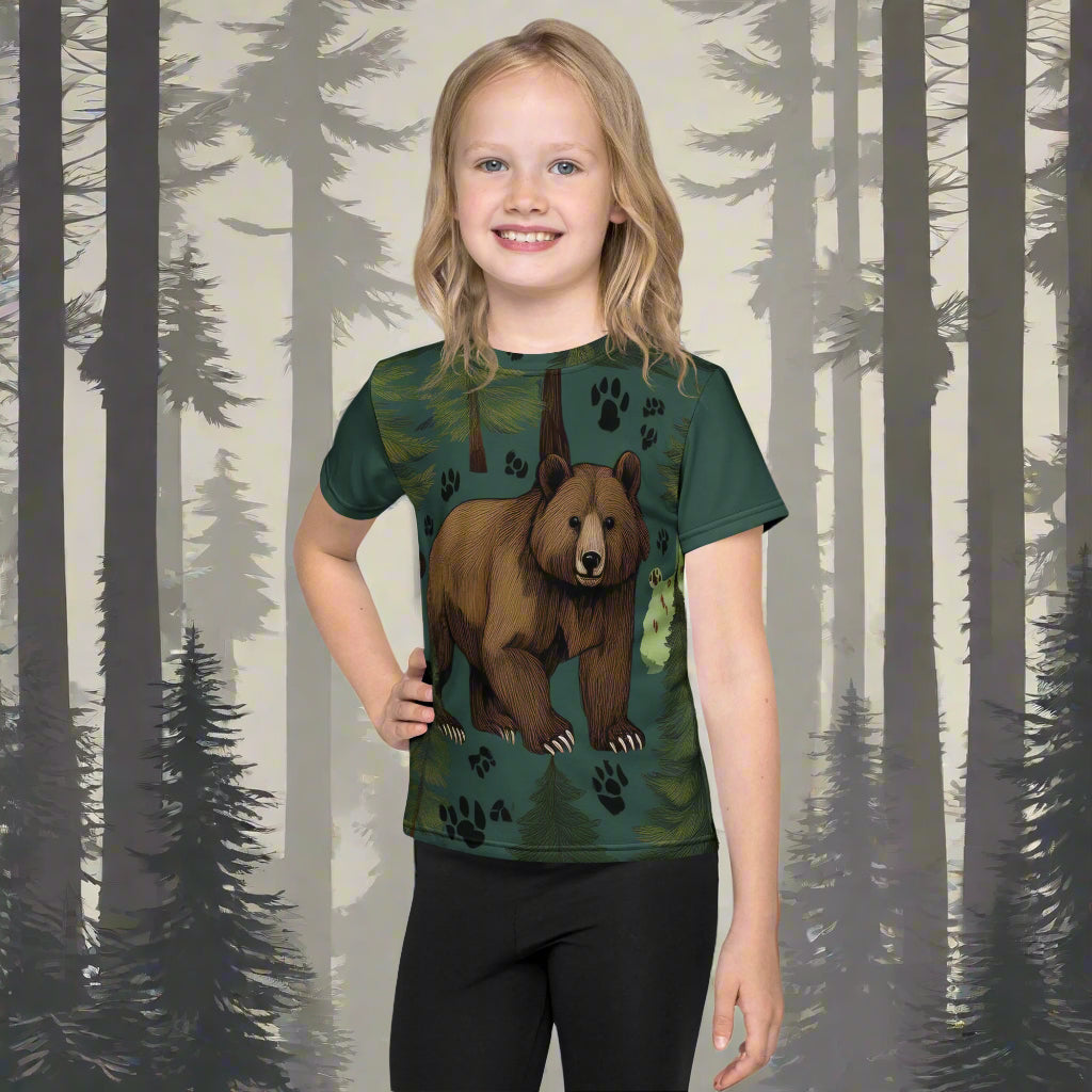 A girl wearing a pine green t-shirt with a picture of a bear on the fromt, surrounded by paw prints, by Rosenmay Studio
