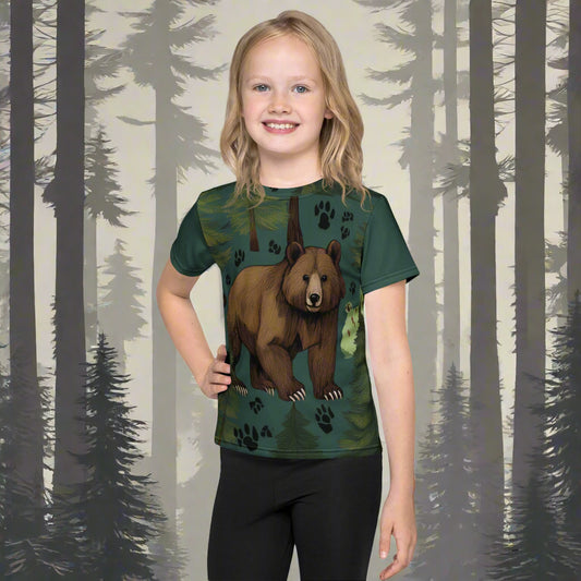 A girl wearing a pine green t-shirt with a picture of a bear on the fromt, surrounded by paw prints, by Rosenmay Studio